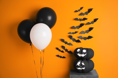 Set of Halloween decorations on color background