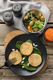 Photo of Healthy food high in vegetable fats and spices on wooden table, flat lay