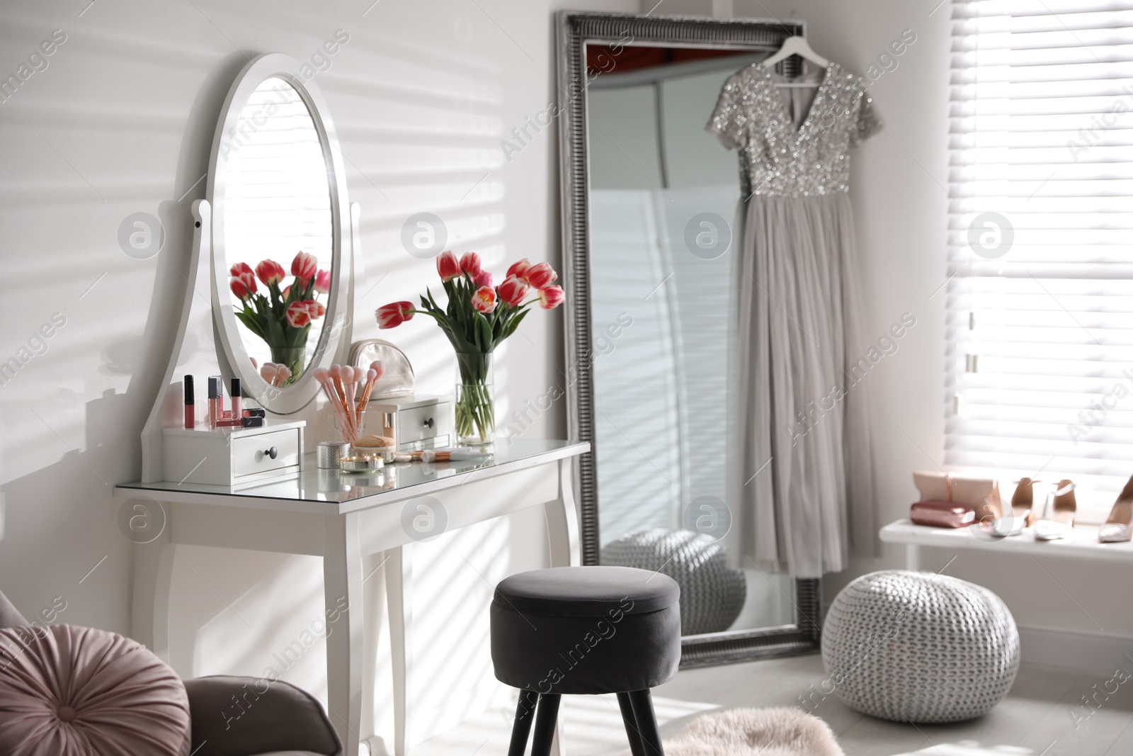 Photo of Stylish room interior with elegant dressing table and mirror