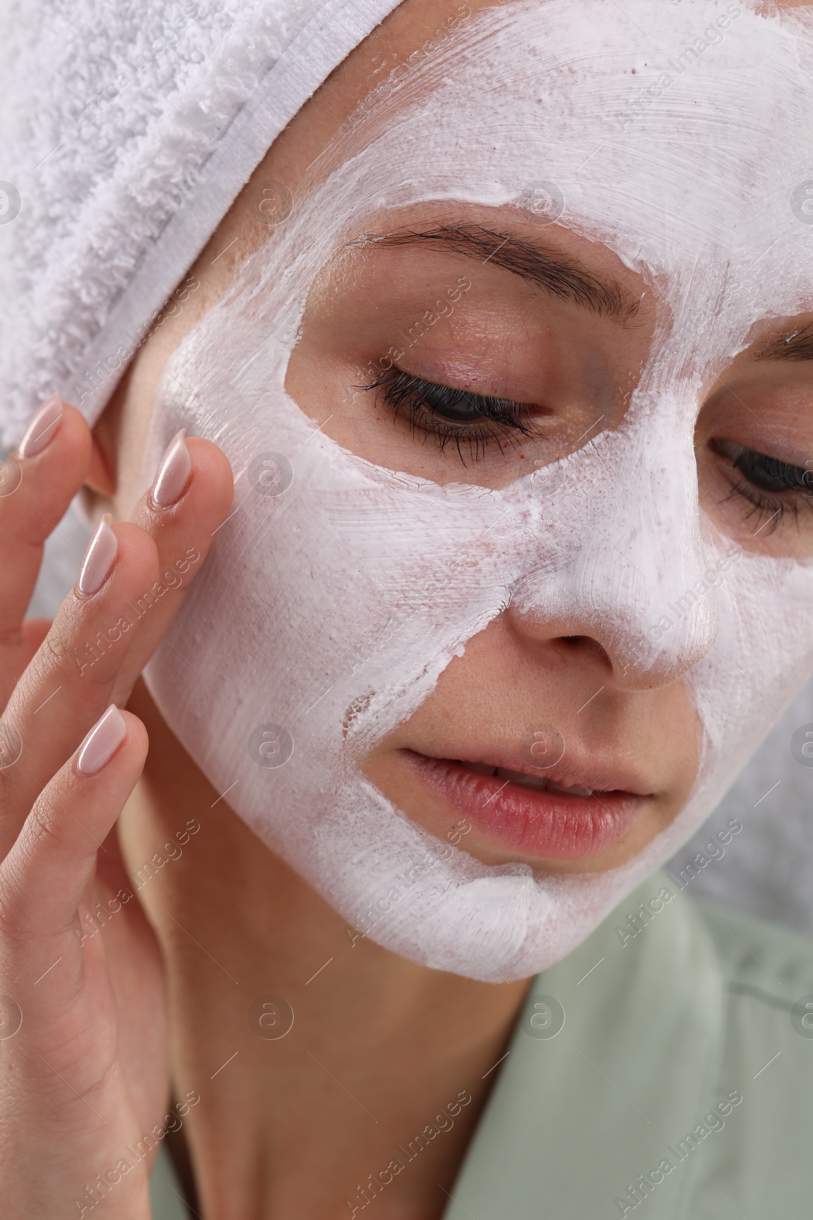 Photo of Woman with face mask, closeup. Spa treatments