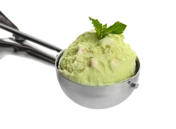 Photo of Scoop of delicious pistachio ice cream on white background
