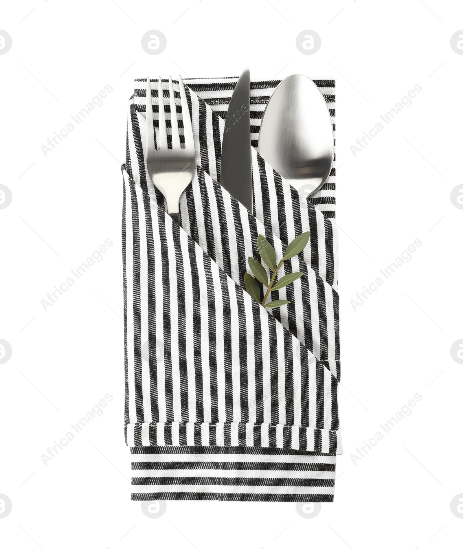 Photo of Folded napkin with fork, spoon and knife on white background, top view