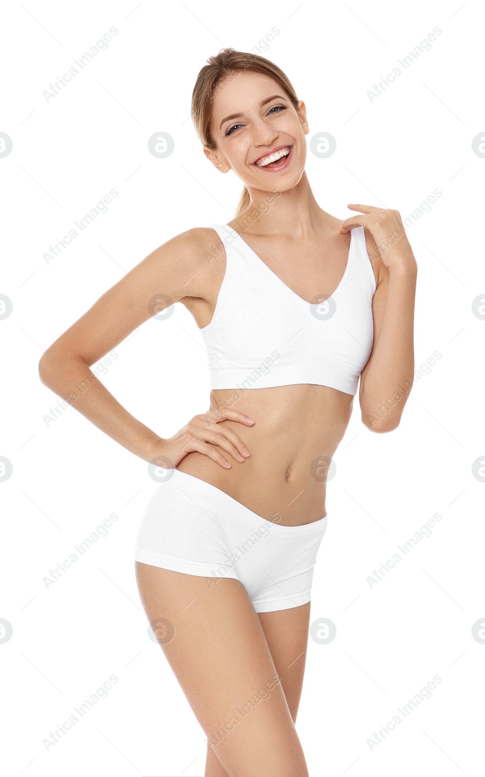 Photo of Happy young woman in underwear satisfied with her diet results, isolated on white