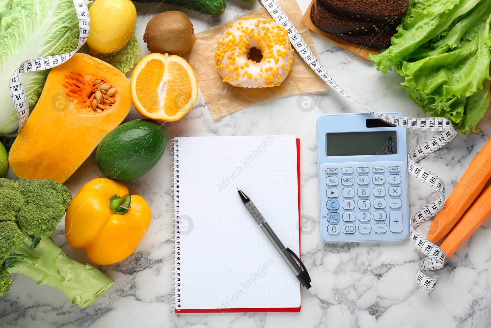 Photo of Food products, notebook with calculator on white marble table, flat lay. Weight loss and calorie counting concept