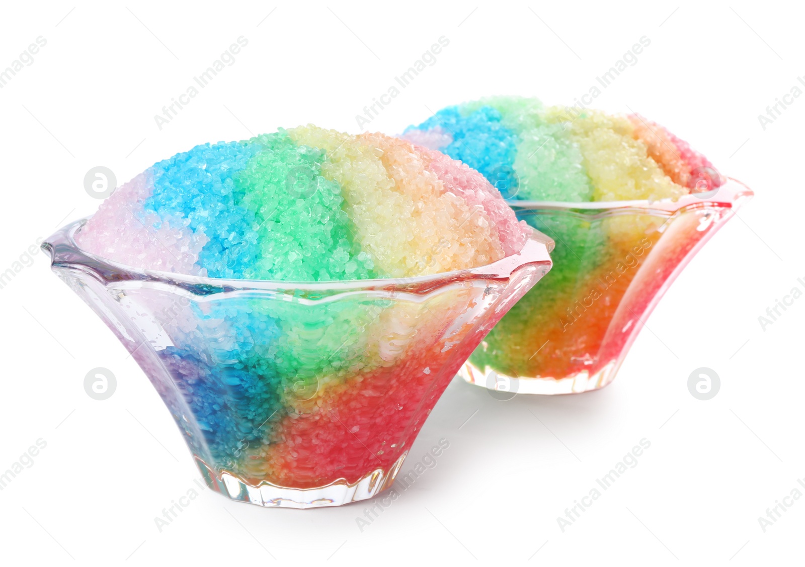 Photo of Rainbow shaving ice in glass dessert bowls isolated on white