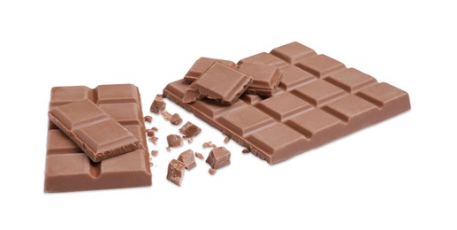 Photo of Pieces of delicious milk chocolate bars on white background