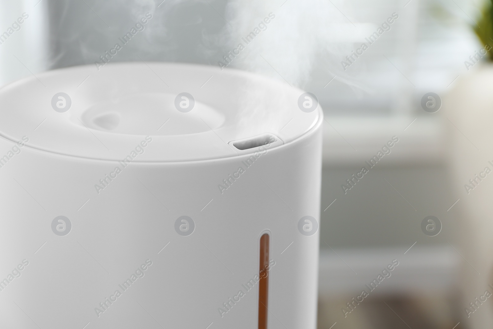 Photo of Modern air humidifier at home, closeup view