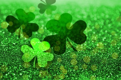 Image of St. Patrick's Day greeting card design with clover leaves, bokeh effect