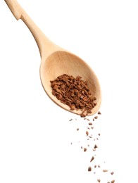 Photo of Pouring instant coffee from wooden spoon on white background