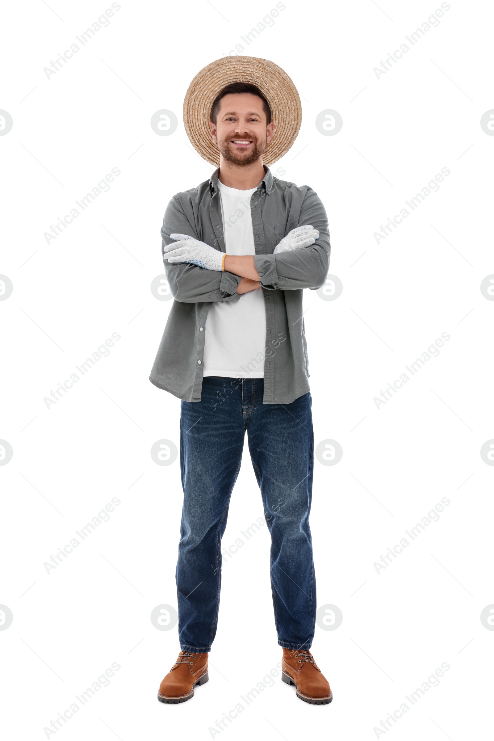 Photo of Harvesting season. Happy farmer with crossed arms on white background