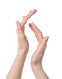 Photo of Woman applying cream on her hand against white background, closeup