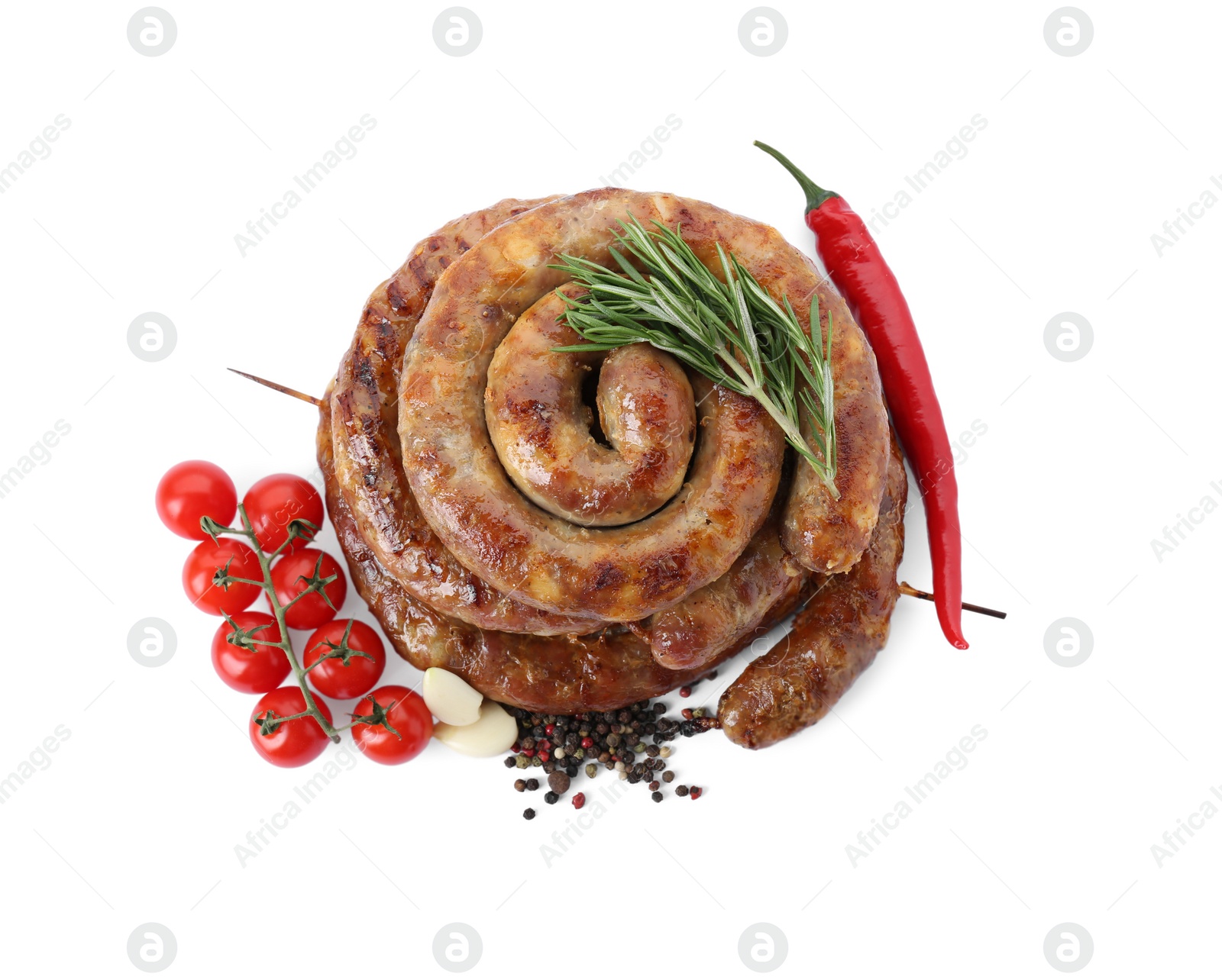 Photo of Rings of delicious homemade sausage with spices, chili pepper and tomatoes isolated on white, top view