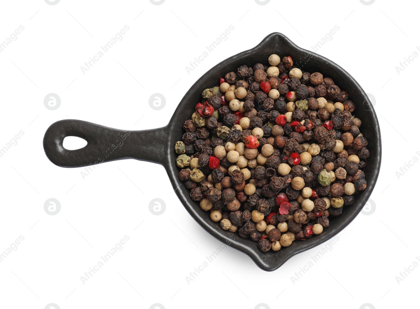 Photo of Aromatic spices. Different peppers in bowl isolated on white, top view