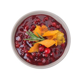 Photo of Fresh cranberry sauce, rosemary and orange peel in bowl isolated on white, top view