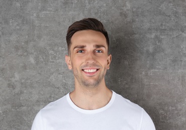 Photo of Portrait of handsome man on color background