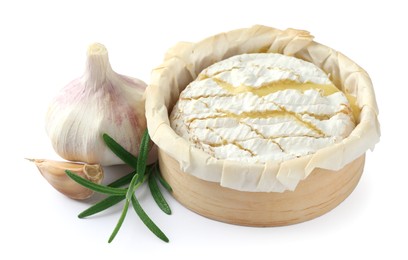 Photo of Tasty baked brie cheese, garlic and rosemary isolated on white