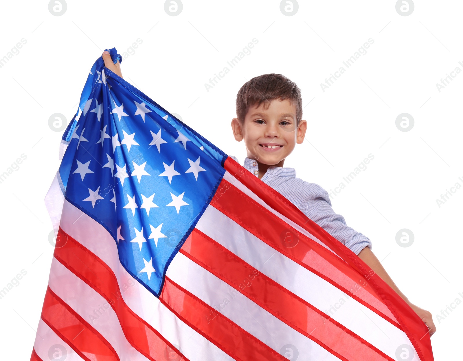 Photo of Portrait of cute little boy with American flag on white background