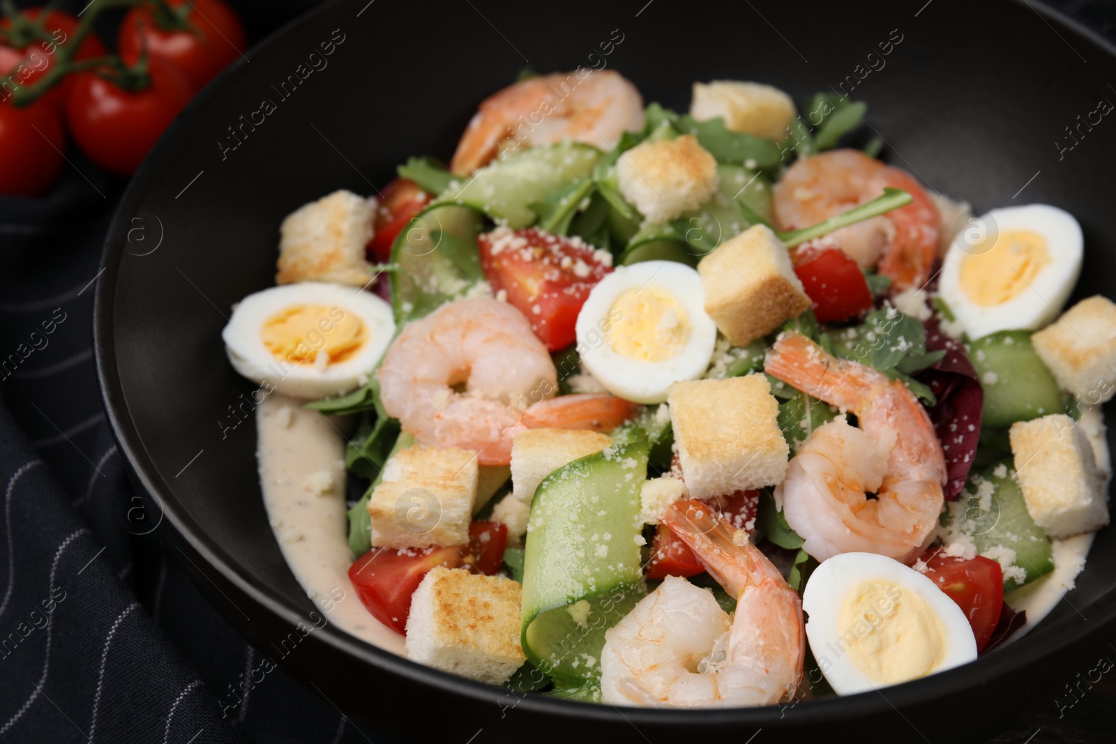 Photo of Delicious Caesar salad with shrimps on table, closeup