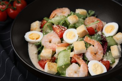 Photo of Delicious Caesar salad with shrimps on table, closeup