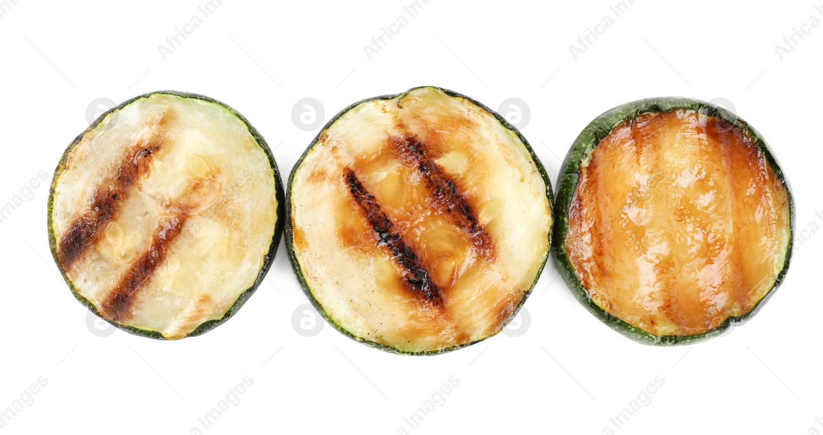 Photo of Delicious grilled zucchini slices on white background, top view