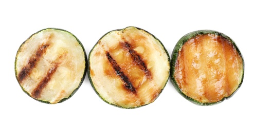 Photo of Delicious grilled zucchini slices on white background, top view