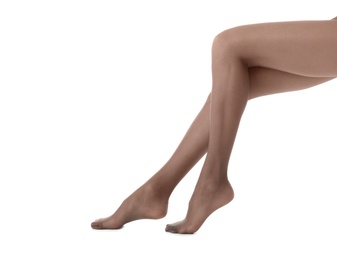 Photo of Legs of beautiful young woman in tights on white background, closeup