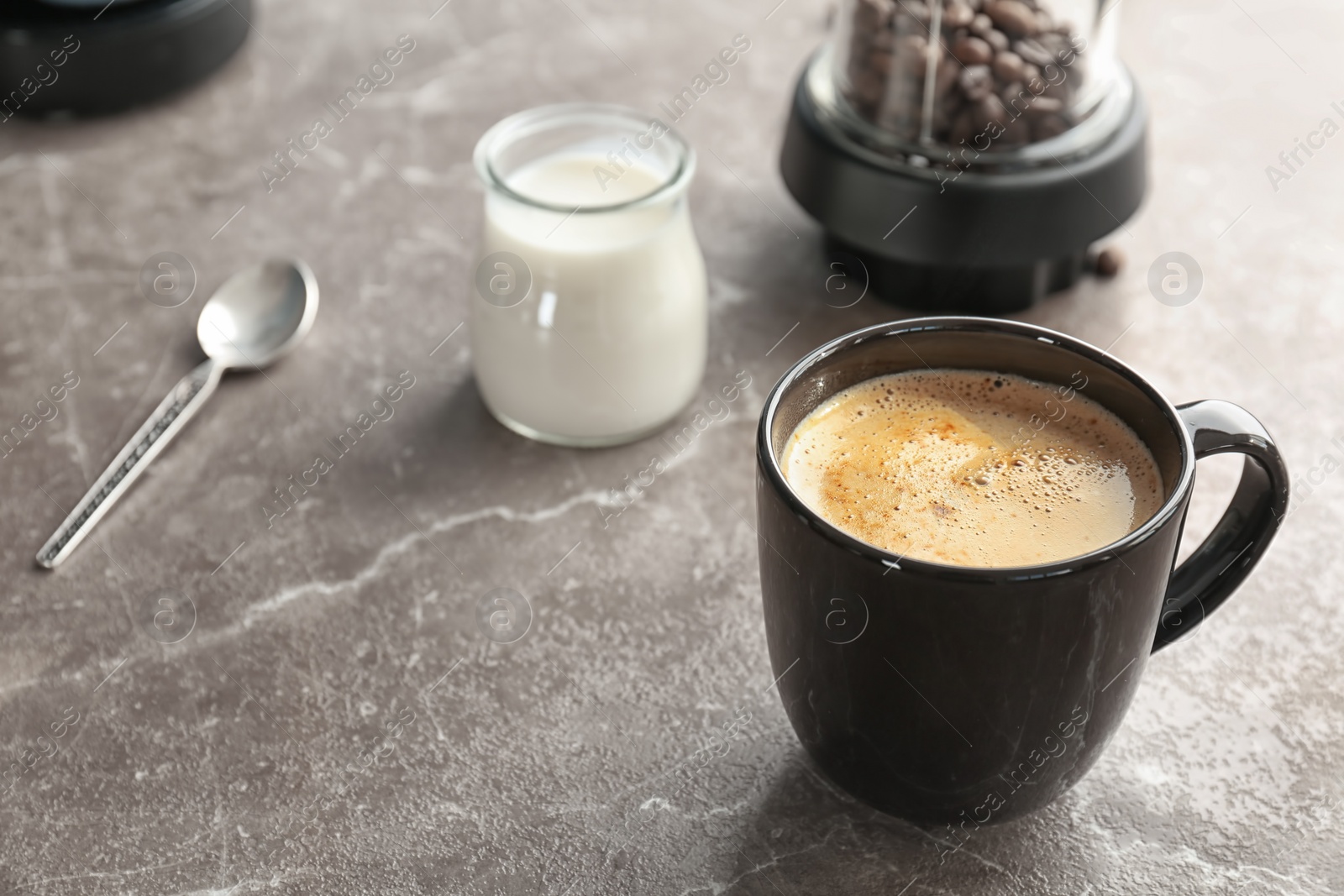 Photo of Cup of aromatic hot coffee on table