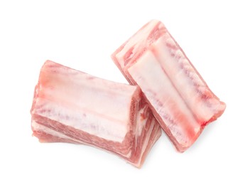Photo of Cut raw pork ribs isolated on white, top view