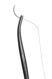 Photo of Forceps with suture thread on white background. Medical equipment