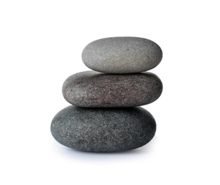 Stack of spa stones on white background