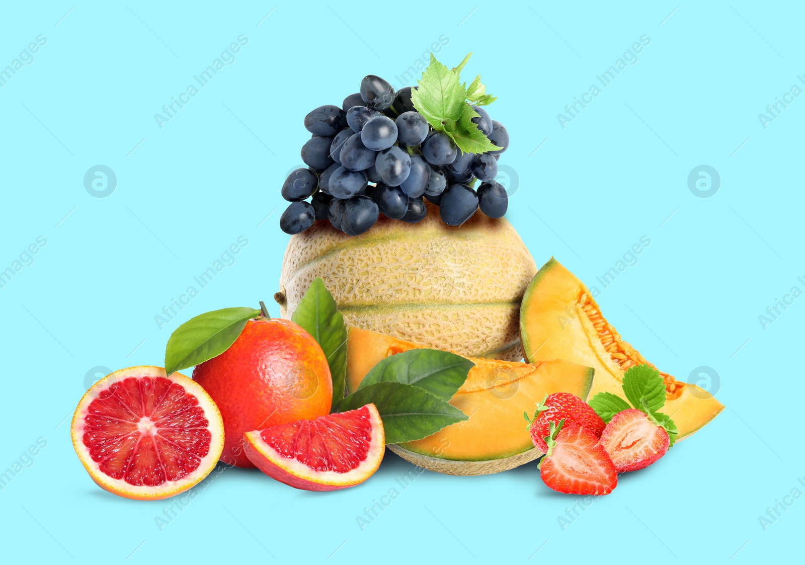 Image of Many different fresh fruits on light blue background