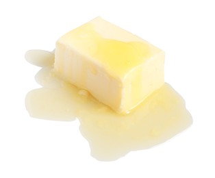 Photo of Piece of melting butter on white background