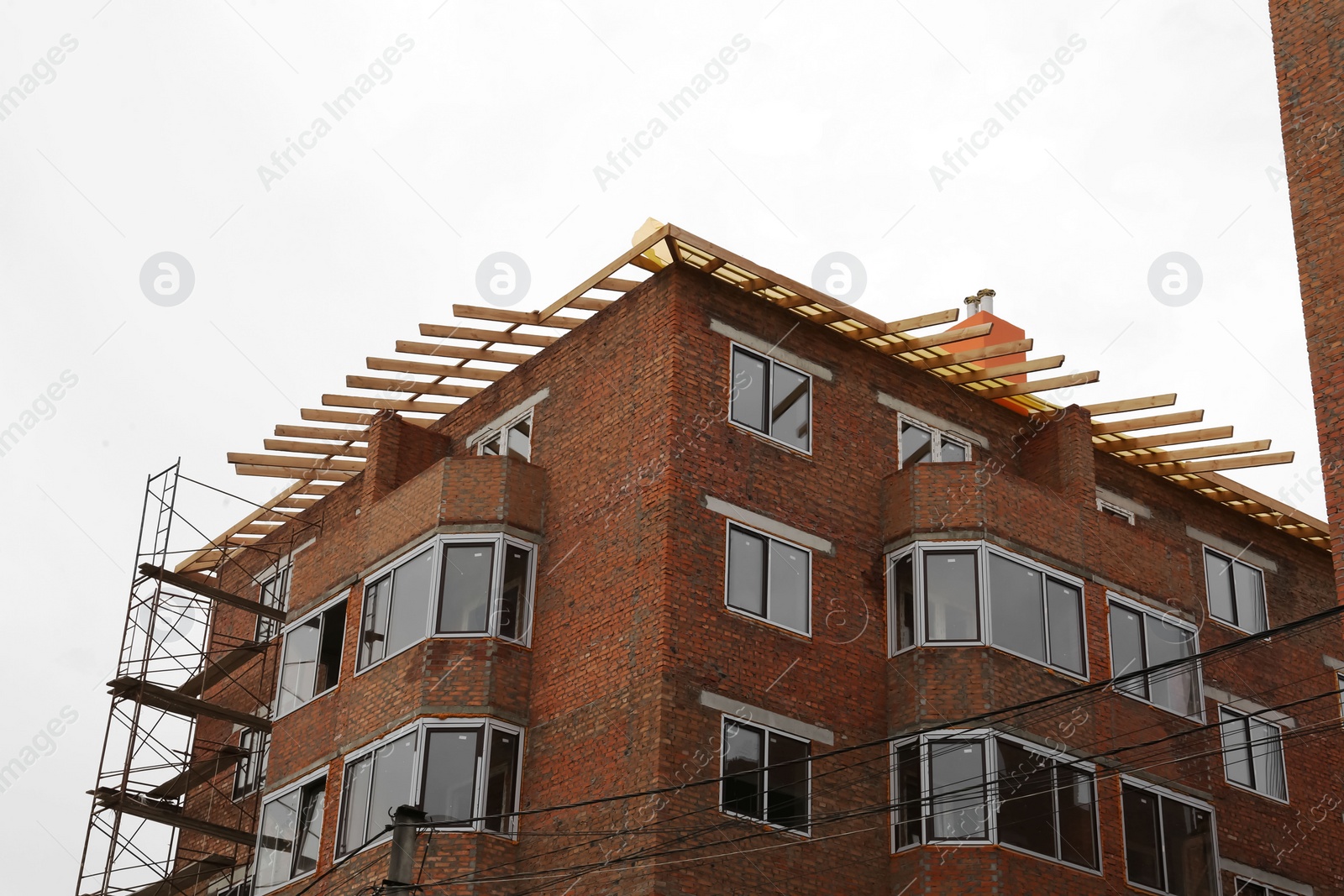 Photo of Construction site with unfinished building against sky