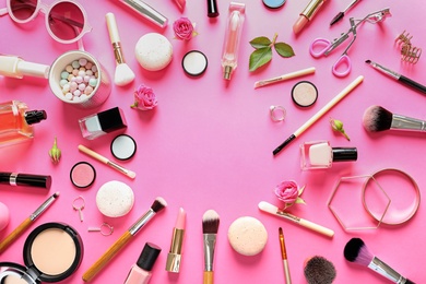 Photo of Flat lay composition with products for decorative makeup on pink background