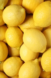 Photo of Fresh lemons with water drops as background, closeup