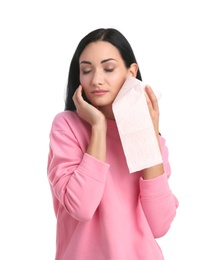 Beautiful woman holding toilet paper roll on white background