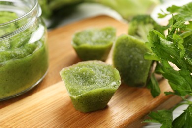 Photo of Frozen broccoli puree cubes on cutting board