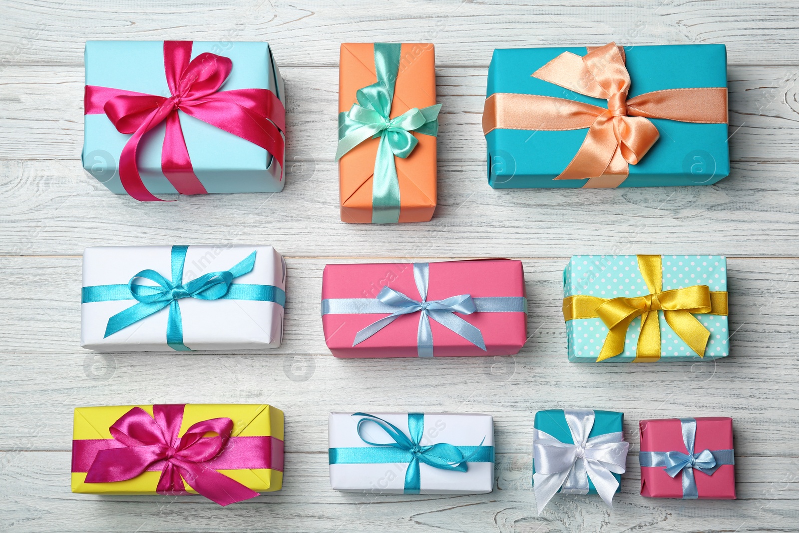 Photo of Flat lay composition with different gift boxes on wooden background