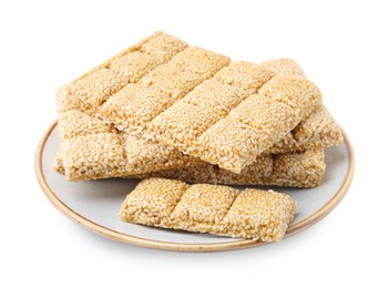 Photo of Plate with tasty sesame kozinaki bars on white background