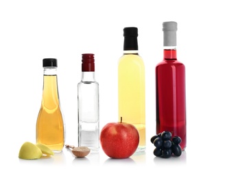 Photo of Composition with different kinds of vinegar and ingredients on white background