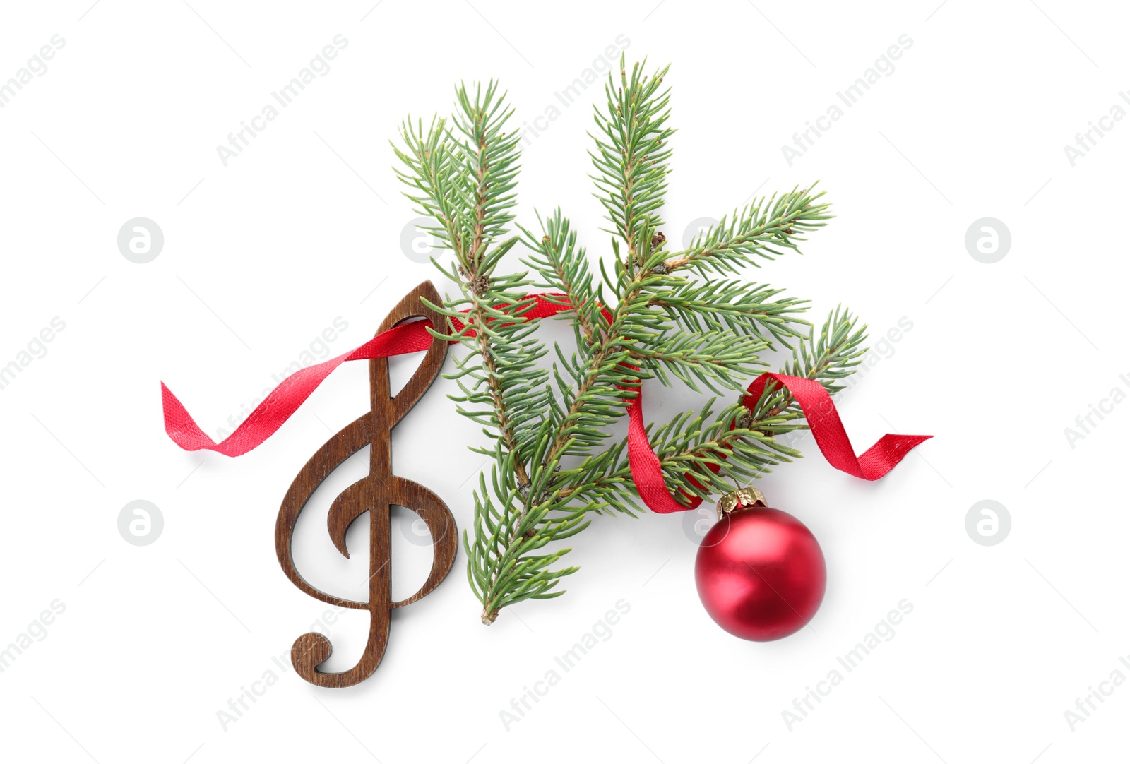 Photo of Composition with Christmas tree branch, decor and wooden music note on white background, top view