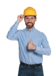 Photo of Professional engineer in hard hat showing thumb up isolated on white