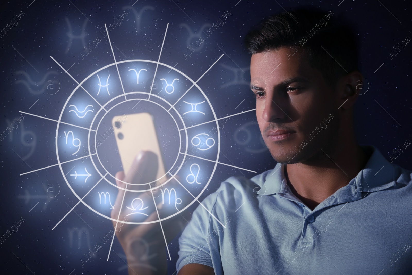 Image of Man with smartphone reading daily horoscope on dark background