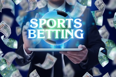 Image of Bookmaking, sports betting. Man using tablet computer, closeup. Soccer ball over device and flying around dollars on blue background