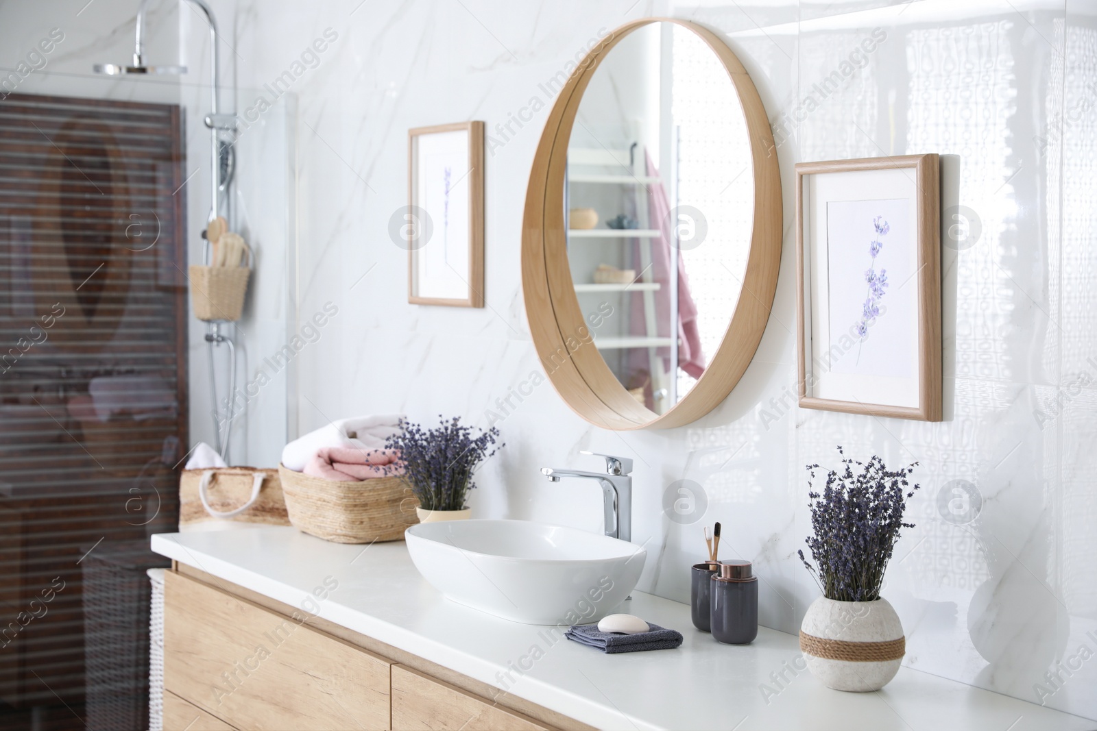 Photo of Mirror and counter with vessel sink in stylish bathroom interior. Idea for design