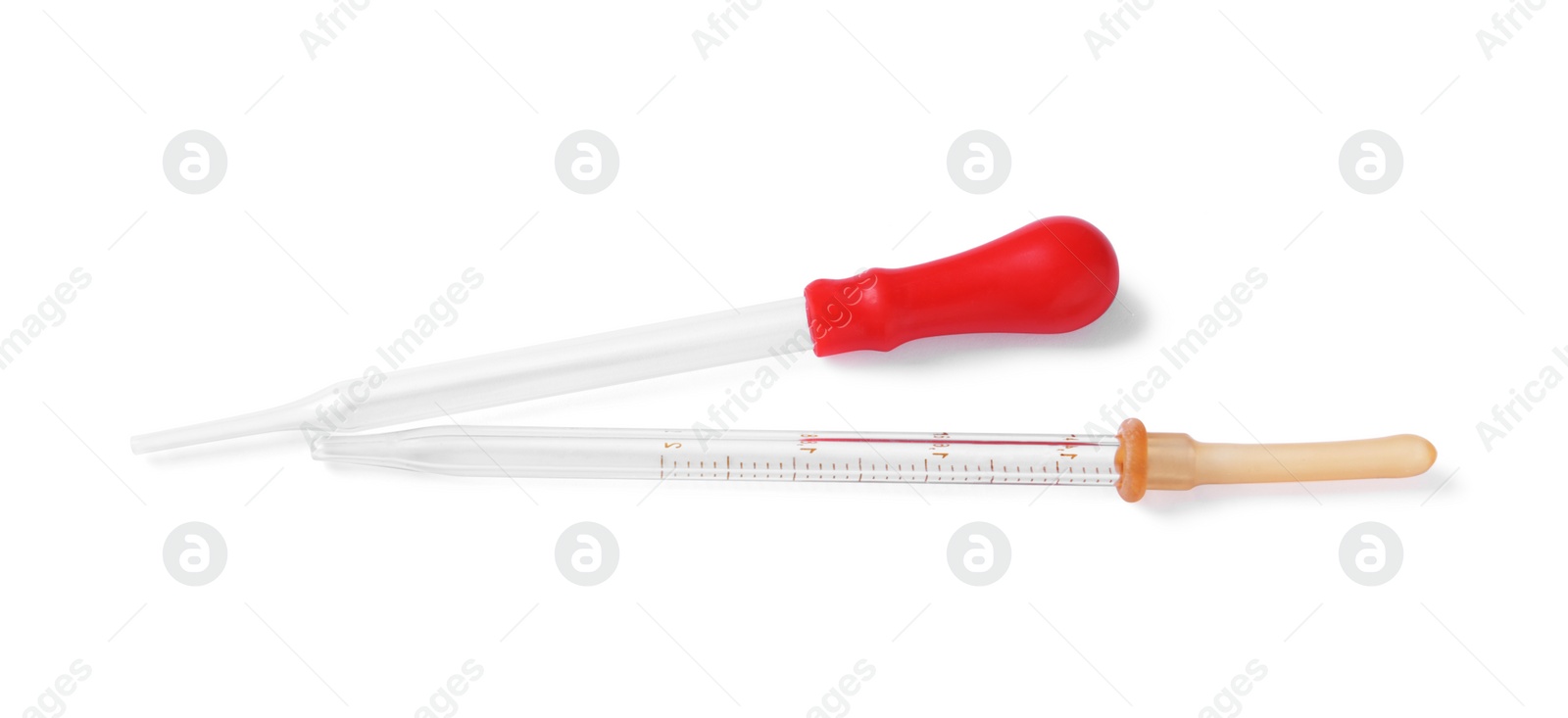 Photo of Two clean pipettes isolated on white, top view