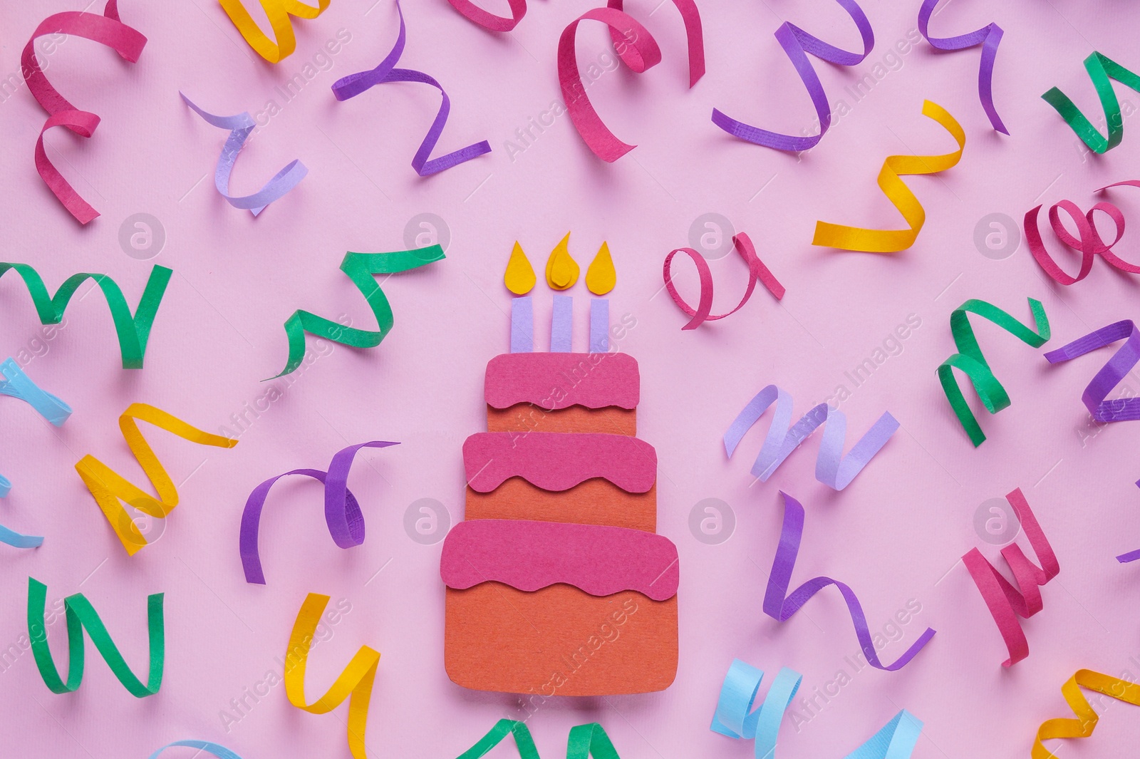 Photo of Birthday party. Paper cake and confetti on pink background, flat lay