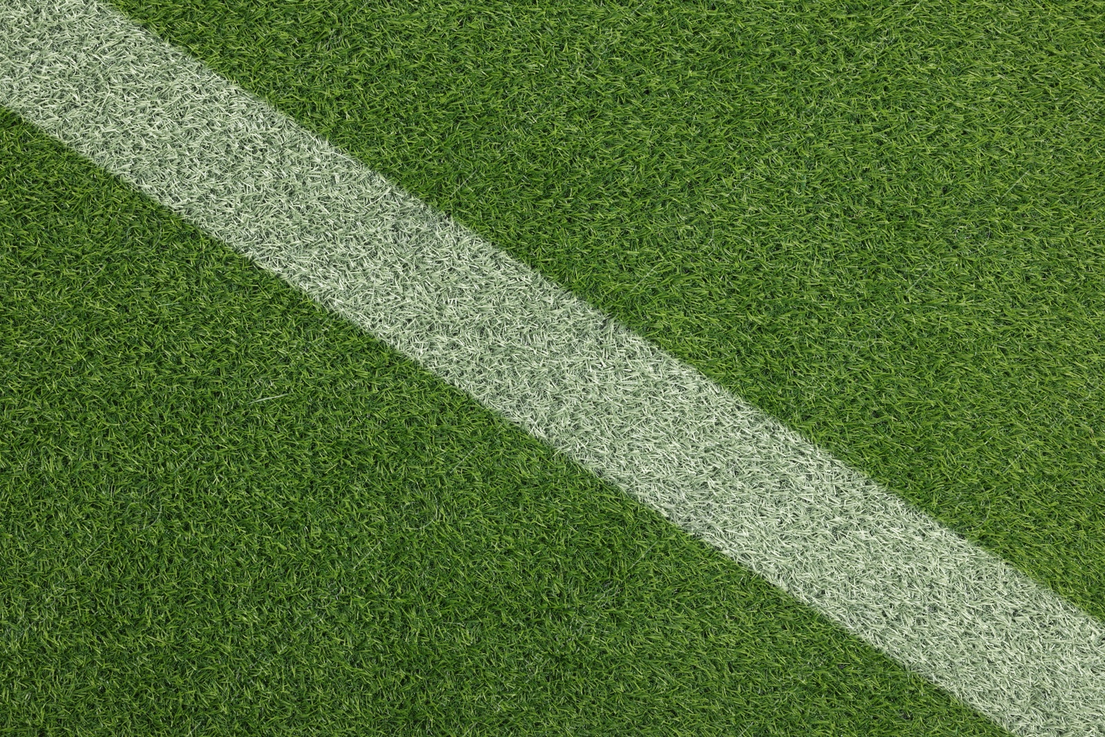 Image of Green grass with white marking, top view