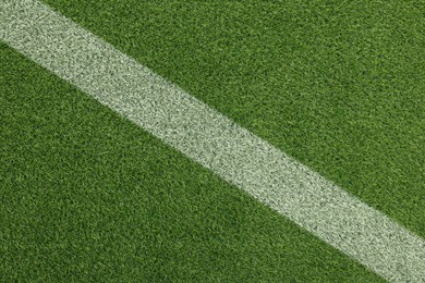 Image of Green grass with white marking, top view