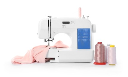 Photo of Sewing machine with fabric and spools of threads isolated on white